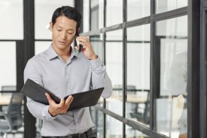 Businessman consulting coworker